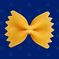 Farfalle pasta pieces shaped like bow ties.