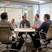 People discussing a topic during a business meeting