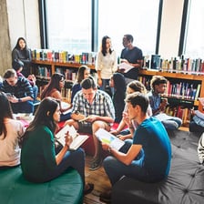 Researchers and students studying in a university library