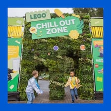 Colorful LEGO bricks are shown alongside a LEGOLAND theme park attraction.