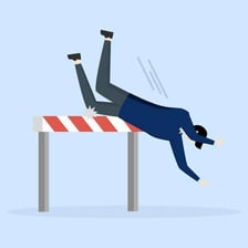 A person stumbling over an obstacle