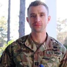 A former U.S. Army soldier in veteran attire.