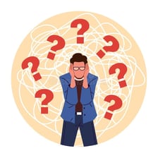 A person appearing puzzled while studying a difficult problem