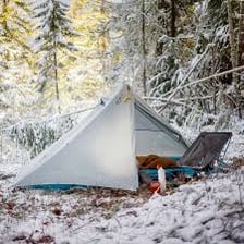 A tent pitched at an outdoor campsite.