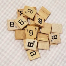 Two Scrabble B tiles displayed with their three-point values.