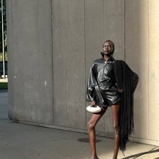 Alek Wek posing as a fashion model.