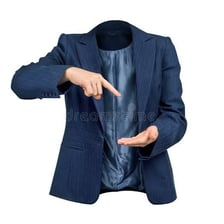 A formally dressed executive seated in an office, suggesting a person of little substance.