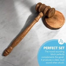 An auctioneer holding a gavel at an auction