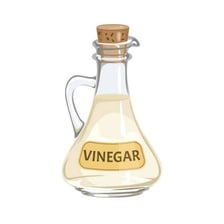 Wine and vinegar bottles shown beside an illustration of acetic acid.