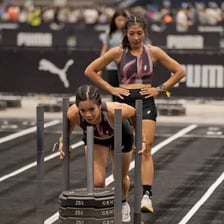 Two athletes competing closely in a race