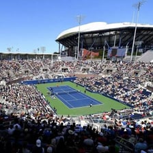 A tennis match being played in an Open tournament
