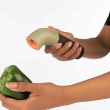 A person smelling food as a basic freshness check.