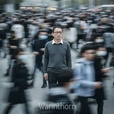 A casually dressed person in an ordinary street portrait