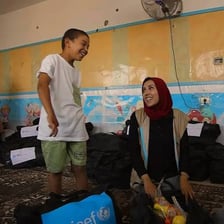 UNICEF aid workers assisting children