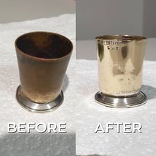 A dull tarnished metal object showing loss of shine