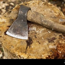 An axe is shown cutting into a piece of wood.