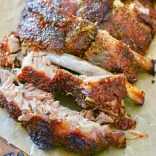 Barbecued spare ribs on a grill.