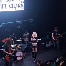 A rock band performing an intense live screamo set