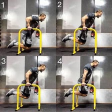 An athlete performing parallel-bar dips to work the chest muscles.