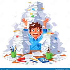 A person surrounded by an overwhelming pile of paperwork