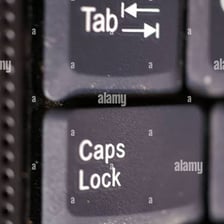A computer keyboard showing the Tab key beside Caps Lock