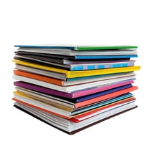 A stack of printed magazines.