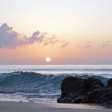 The sun emerging above the horizon