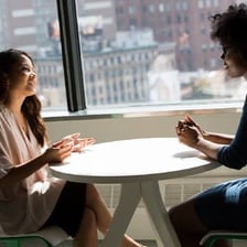 A person speaking candidly to another person