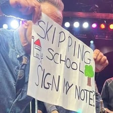 A person moving past a sign or other point.