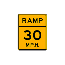 A highway off-ramp marked with an exit sign