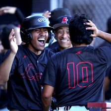 A sports team celebrating after winning every game in a series.
