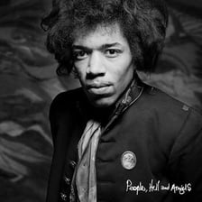 Jimi Hendrix wearing a distinctive afro hairstyle