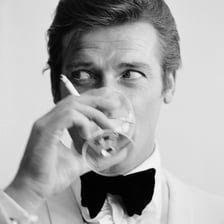 Roger Moore portraying James Bond