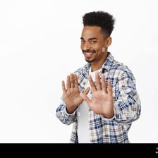 A person making a polite gesture of refusal