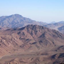 The rugged peak and surrounding landscape of Mount Sinai in Egypt