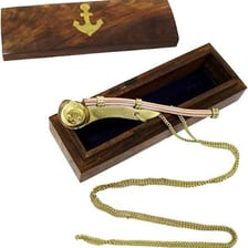 A boatswain using a whistle on a ship’s deck.