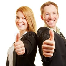 One person congratulating another with a thumbs-up gesture.