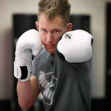 A boxer extending a quick straight jab