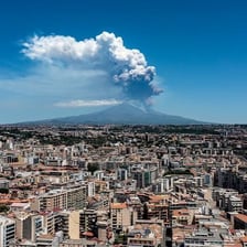 Mount Etna emitting ash and lava during an eruption.