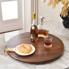 A lazy Susan rotating tray on a dining table.