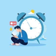 A person sitting around instead of working