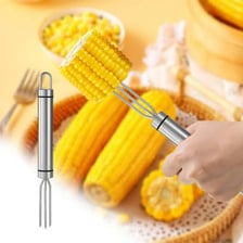 A metal skewer pierces pieces of food.