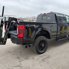 A tow truck repossessing a vehicle