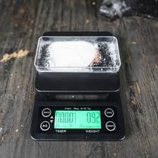 A small mass labeled one gram on a precision scale