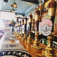 Beer at a pub shown alongside a mechanical axle