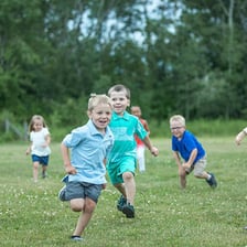 Children running while playing a game of tag