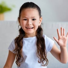 A person greeting someone with a raised waving hand