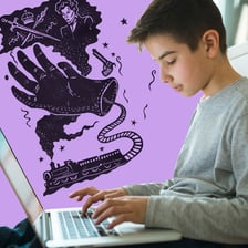 A person writing a fan-fiction story on a laptop.
