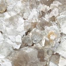 Shimmering flakes of mica mineral used in cosmetics.