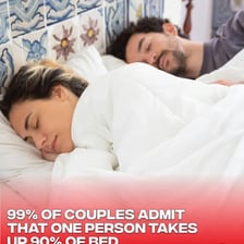 A sleeping person occupying most of a bed
